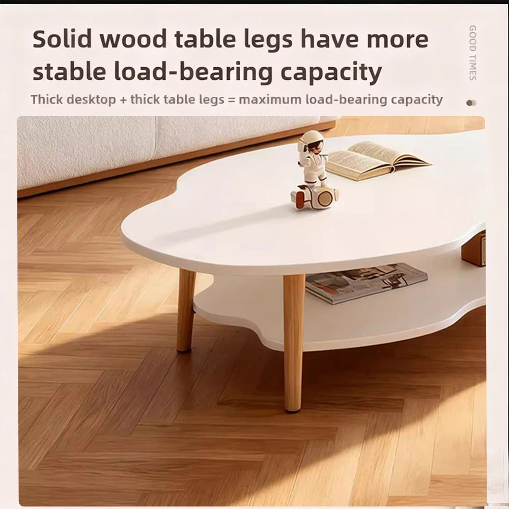 A white cloud-shaped coffee table with light wood legs in a living room setting, with text overlay at the top explaining load-bearing capacity.