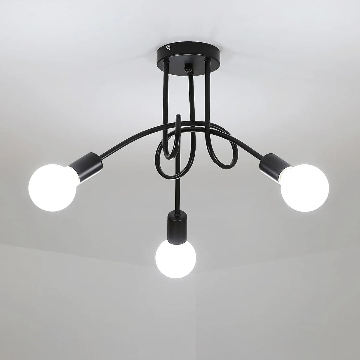 Modern black ceiling light fixture with multiple bulbs on a gray background