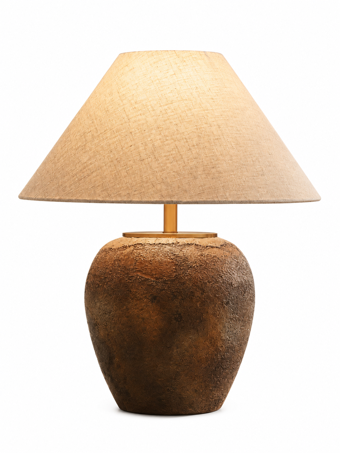 A table lamp with a textured, earthy brown ceramic or stone base and a warm beige fabric drum shade, shown against a plain white background.