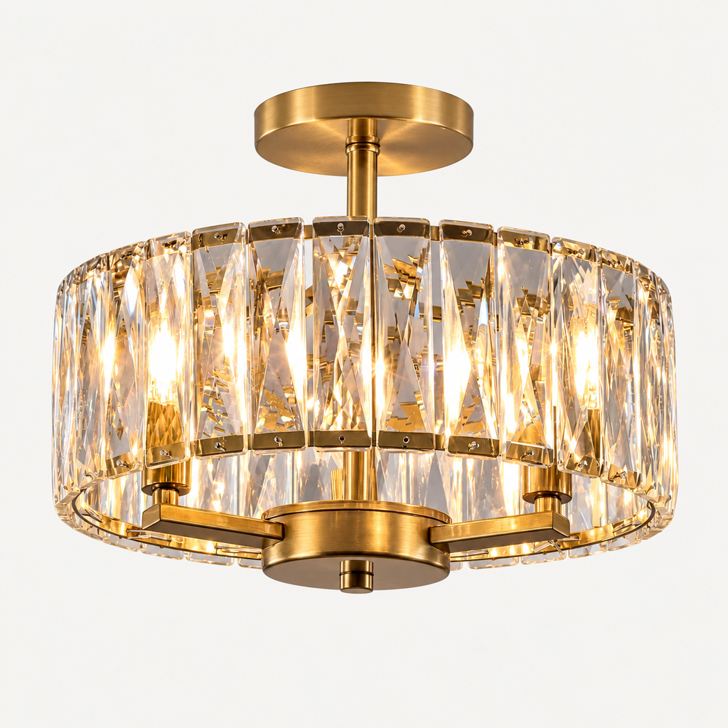 A modern semi-flush mount ceiling light fixture with a brushed gold metal frame and clear cylindrical crystal prisms, shown illuminated against a plain white background.