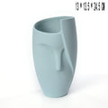 Light blue ceramic vase with a unique design on a white background with dimensions displayed 
