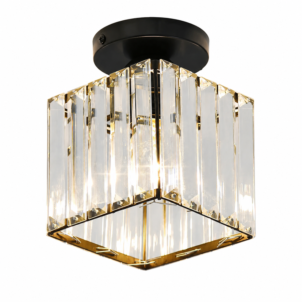 A modern semi-flush mount ceiling light fixture featuring a black circular ceiling canopy and a geometric cube-shaped crystal prism shade with gold-toned metal trim and warm white LED lighting.