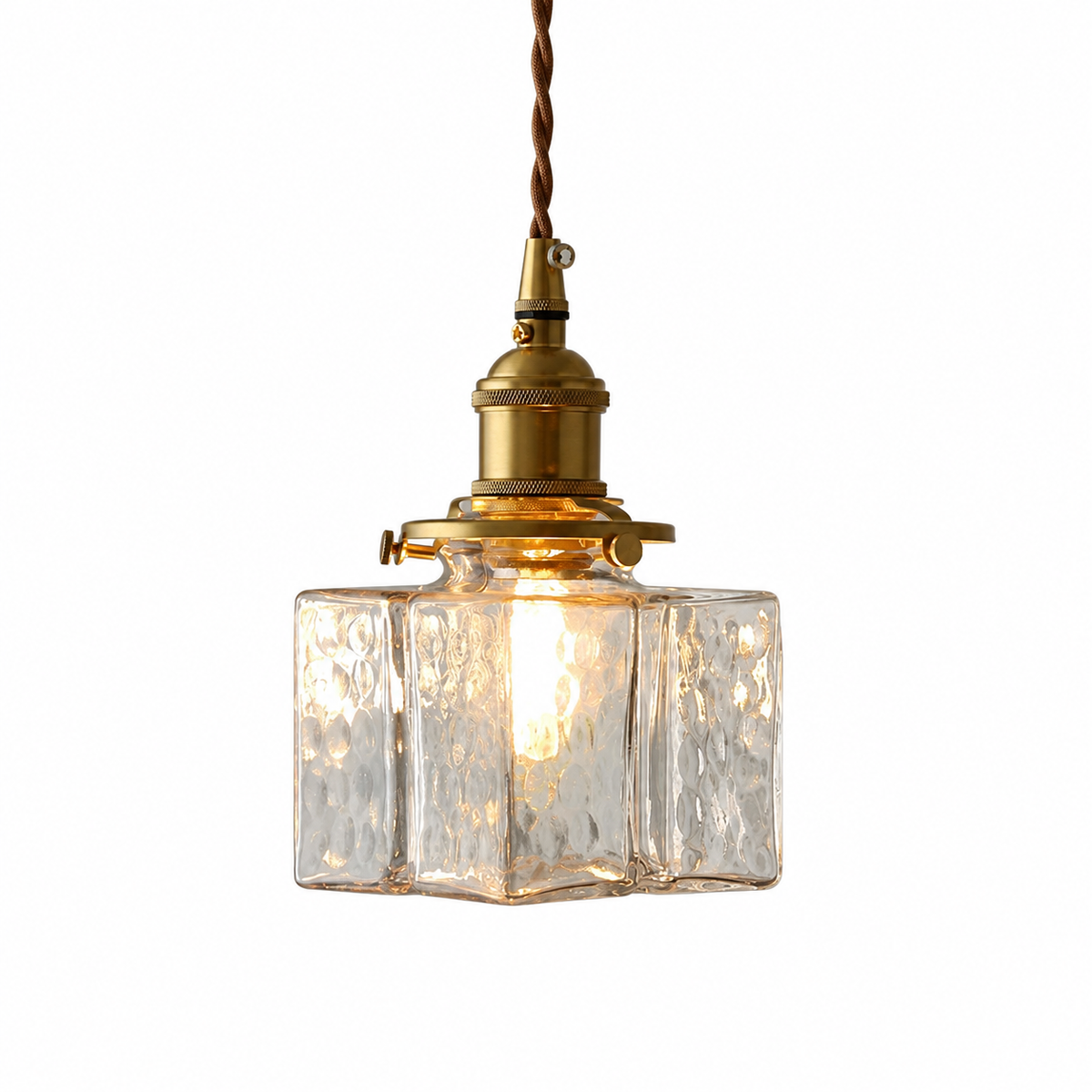 A vintage-style pendant light with a hammered clear glass shade and a brass-toned metal fixture, suspended by a brown cord against a plain white background.