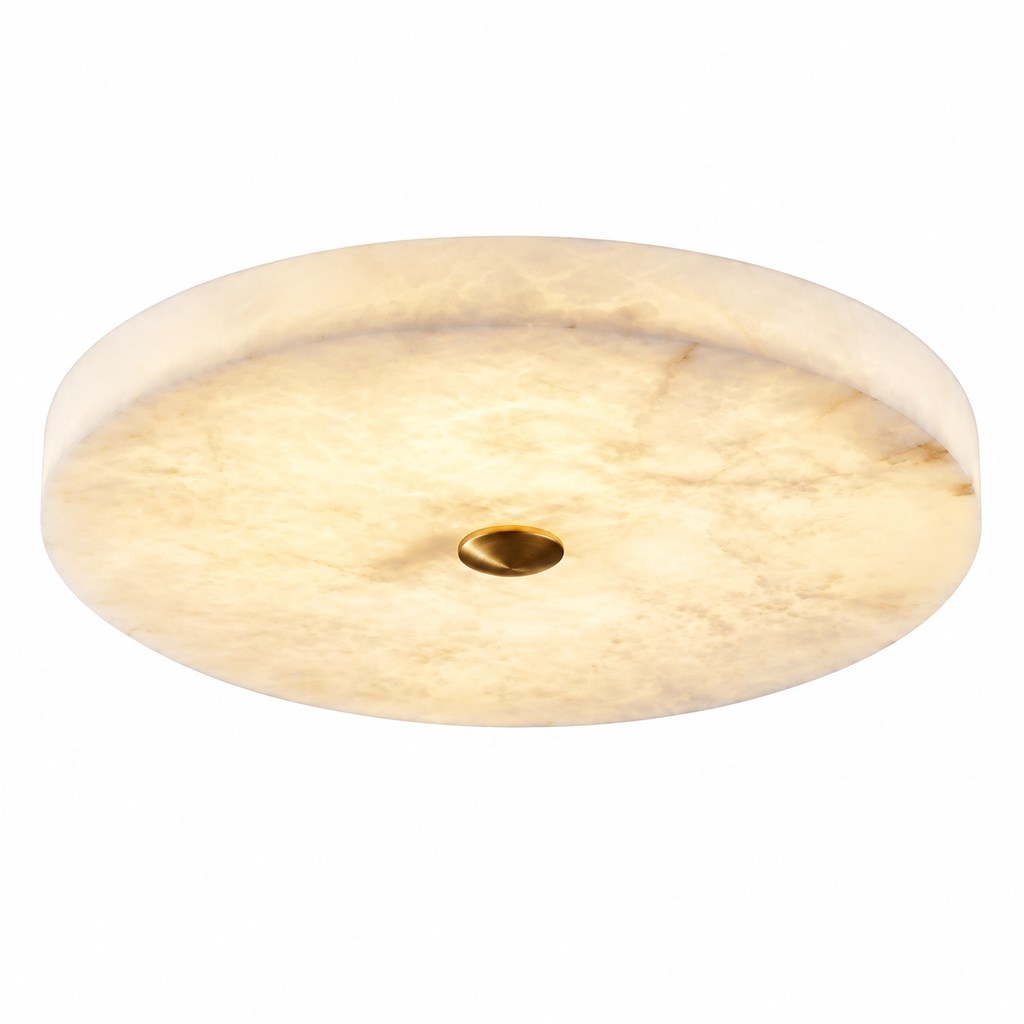 A round flush-mount ceiling light fixture made of warm cream-colored marble with a central gold-toned mounting hole, shown against a solid white background.