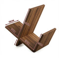 Modern walnut wooden book display shelf with geometric sculptural design organizing books on a contemporary desk