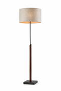 A modern floor lamp with a cylindrical beige fabric shade, a dark brown central stem, and a square black base, shown against a plain white background.