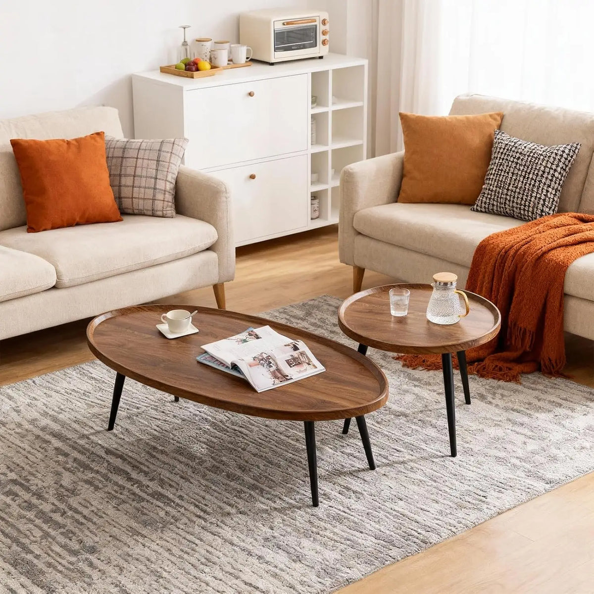 Living room with beige sofas, wooden coffee table, and a white cabinet.