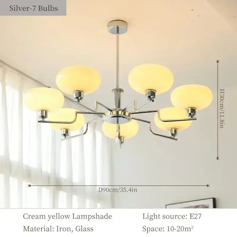 Chandelier with yellow glass lampshades and measurements on a neutral background