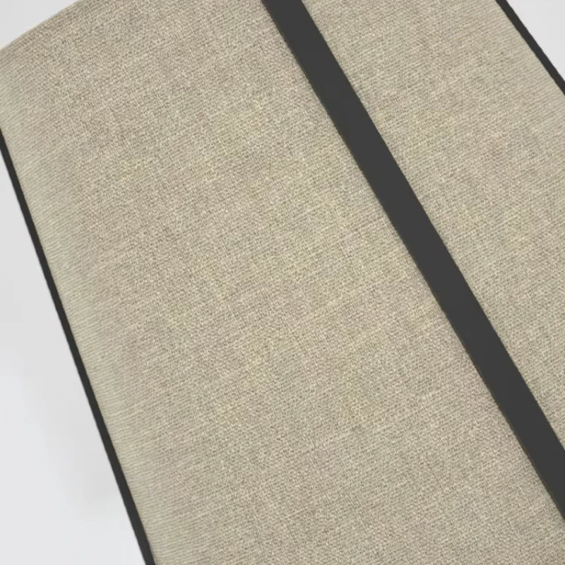 Textured beige mat with a black stripe on a white background