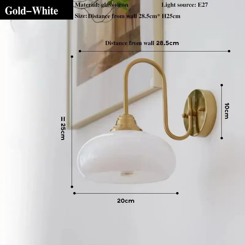 Gold and white wall lamp with dimensions on a white background