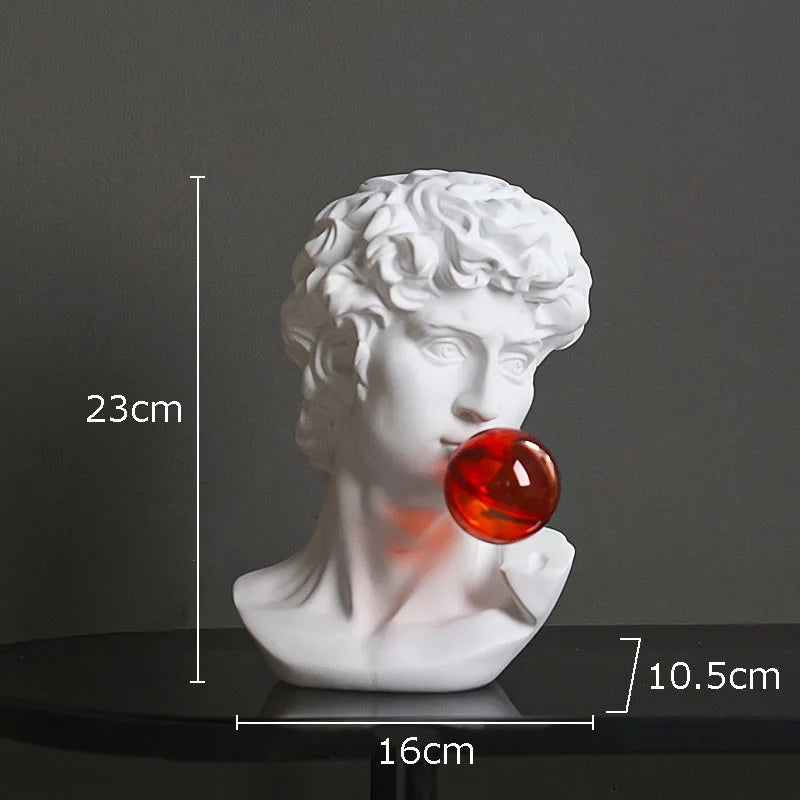 White classical-style bust sculpture light resembling Michelangelo's David, shown on a dark surface against a dark gray background with overlaid dimension markers: 23 cm height, 16 cm width, and 10.5 cm base width.