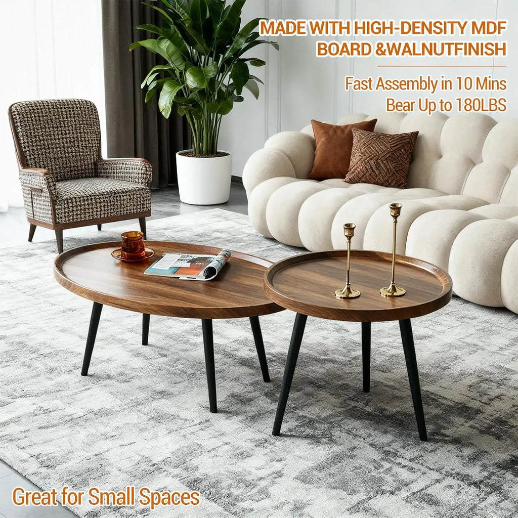 Modern living room with a sofa, armchair, and coffee tables with decorative items.