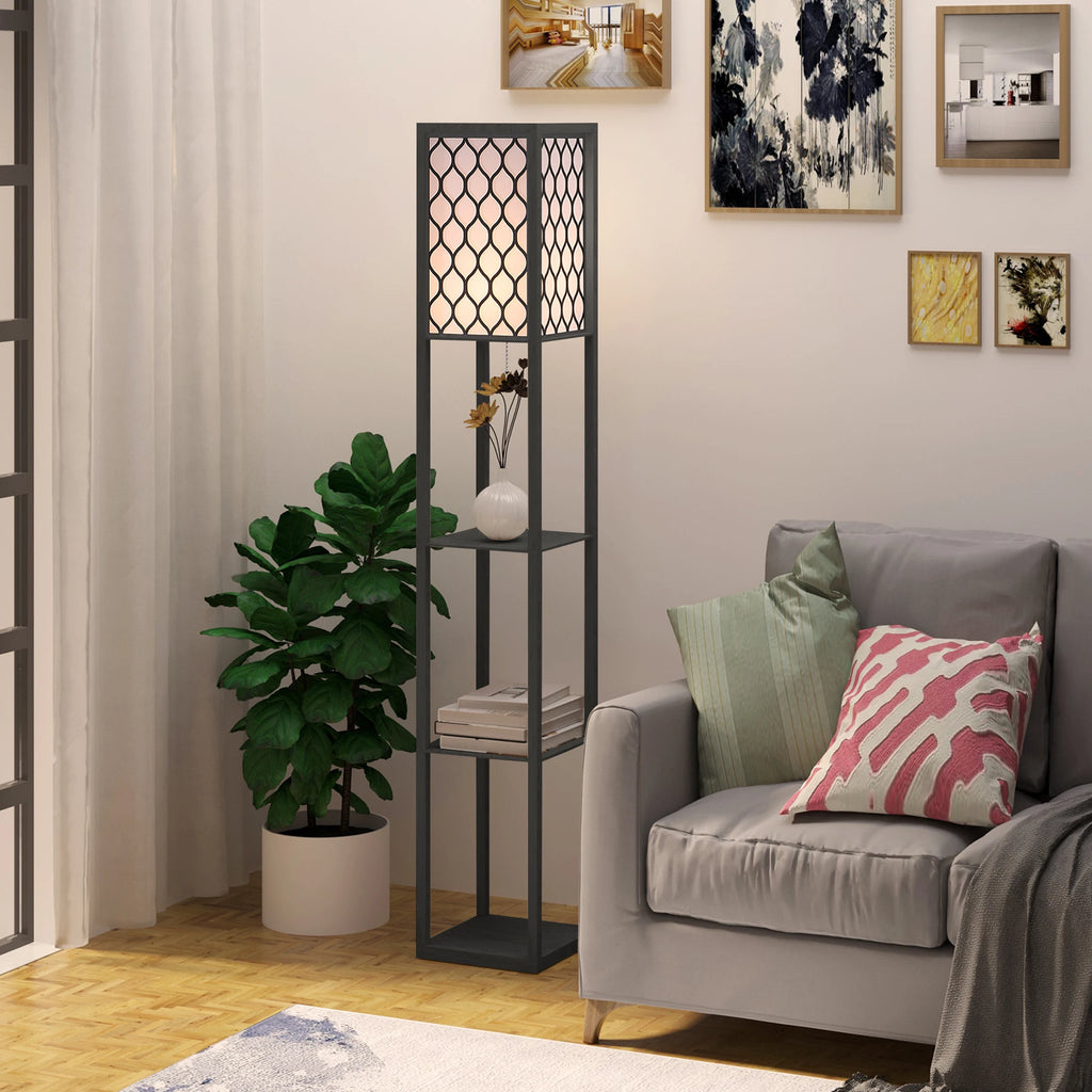 Living room with a gray sofa, decorative pillows, a floor lamp, and wall art.