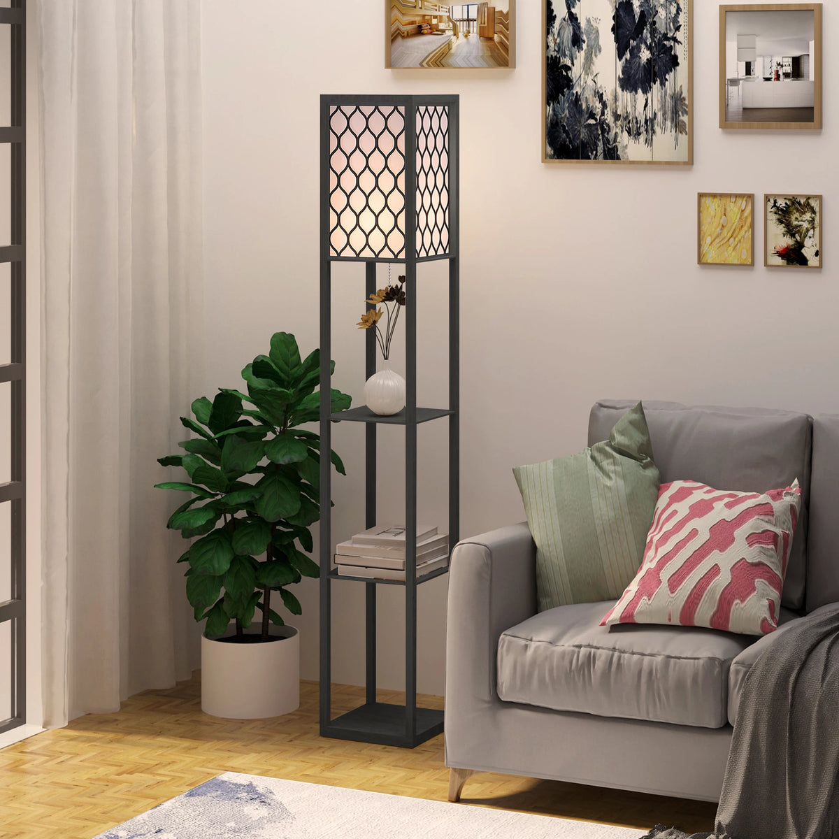 Living room with a gray sofa, decorative pillows, a floor lamp, and wall art.