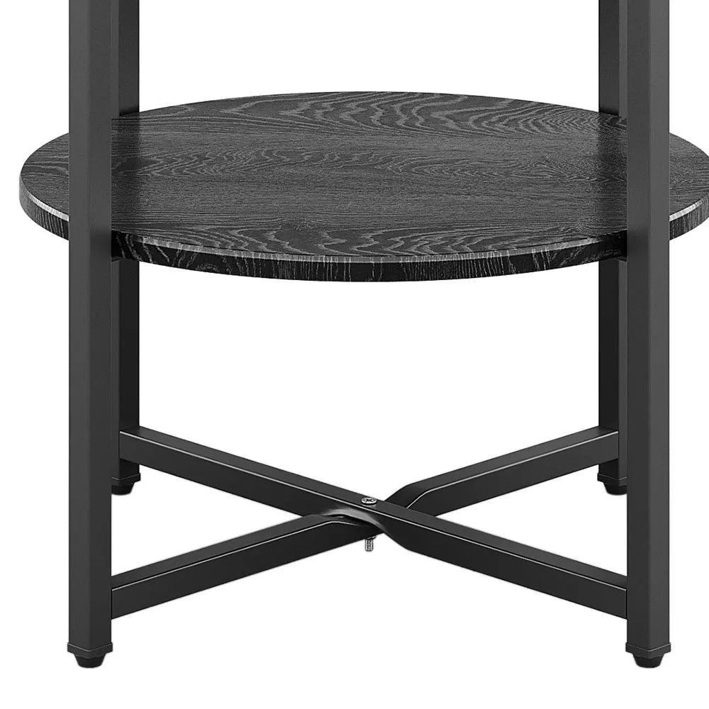 Black round side table with wavy pattern on a white background