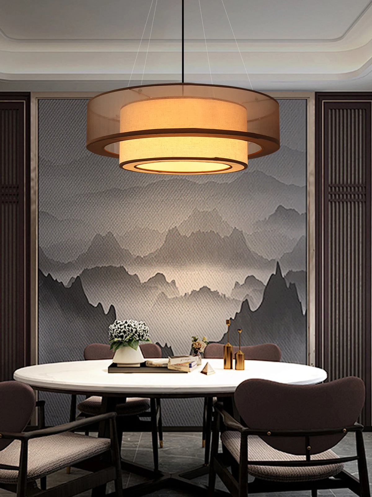 Drum like ceiling light over a modern dining table 