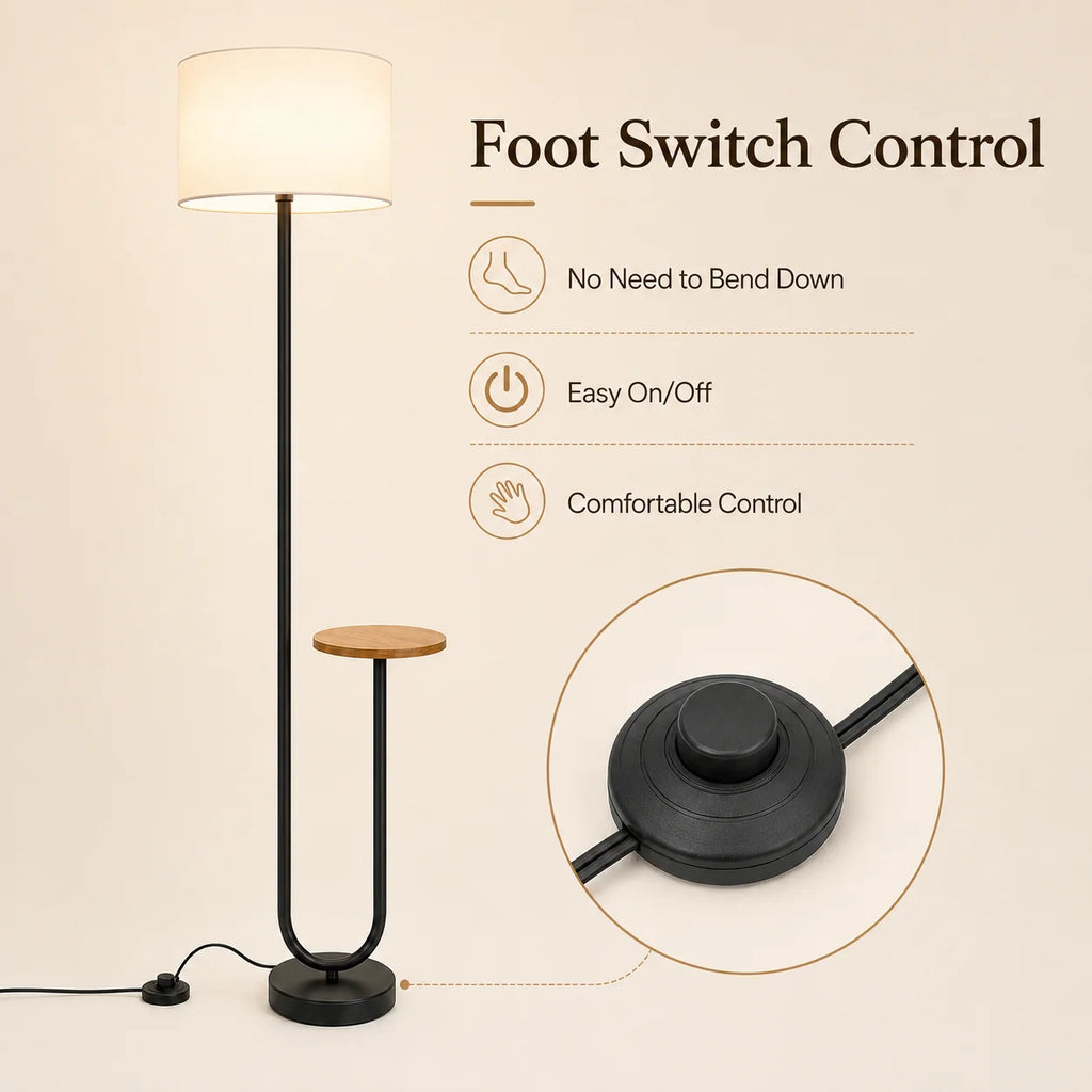 A modern floor lamp with a black metal frame, warm white cylindrical shade, and small round wooden side table on a beige background. Text reads 'Foot Switch Control' with feature callouts, plus a circular inset showing the foot switch detail.