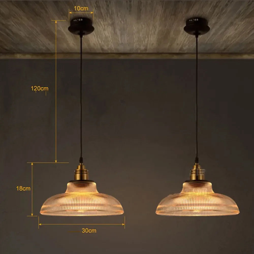 Two pendant lights with measurements on a dark background