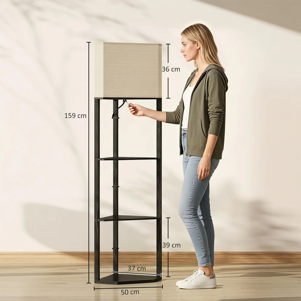A woman stands beside a tall black metal shelving unit with a beige fabric lampshade, shown with dimension callouts for height and width on a warm beige wall and wood floor.