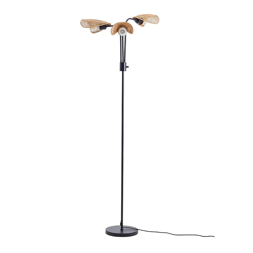 Modern black floor lamp with three woven rattan shades and round base.