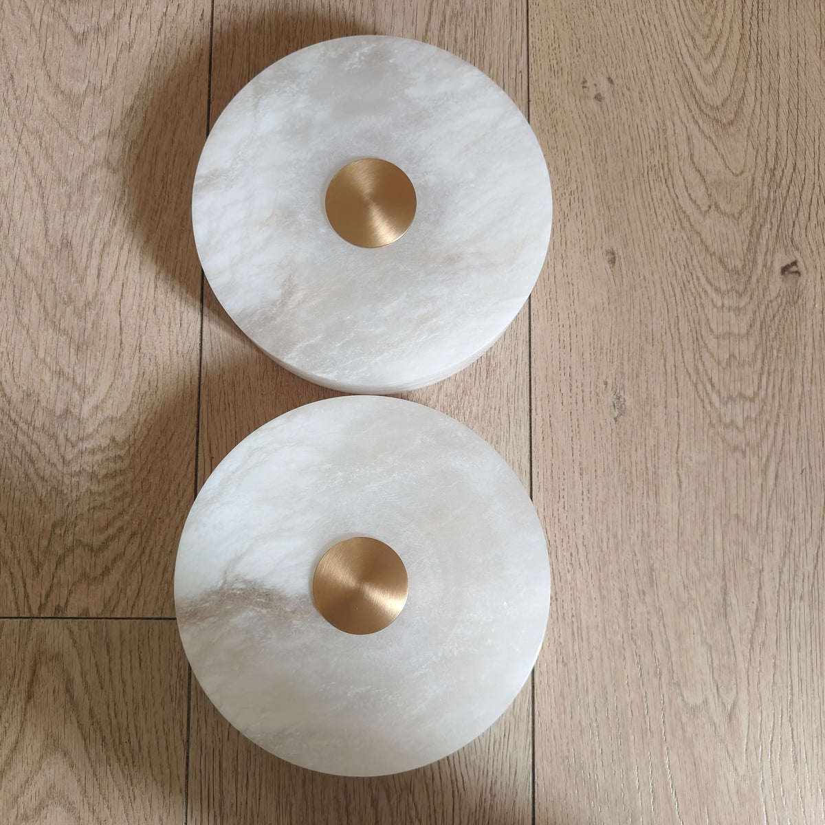 Round ceiling light fixture on a wooden surface