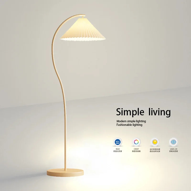 Modern floor lamp with a soft glow on a light gray background, featuring the brand 'Simple living'.