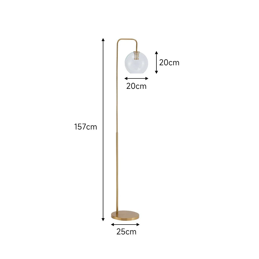A floor lamp with a slim gold metal stand, a round clear glass globe shade, and a circular base, shown with dimension labels indicating 157cm height, 25cm base width, and 20cm shade width.