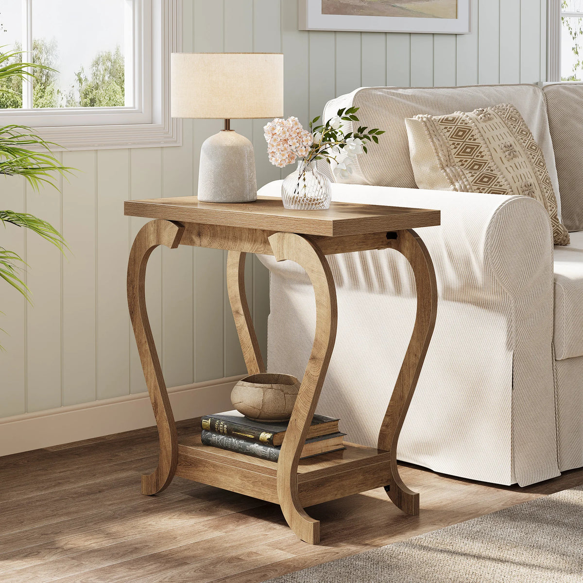 Wooden side table with lamp and decor items in a living room setting