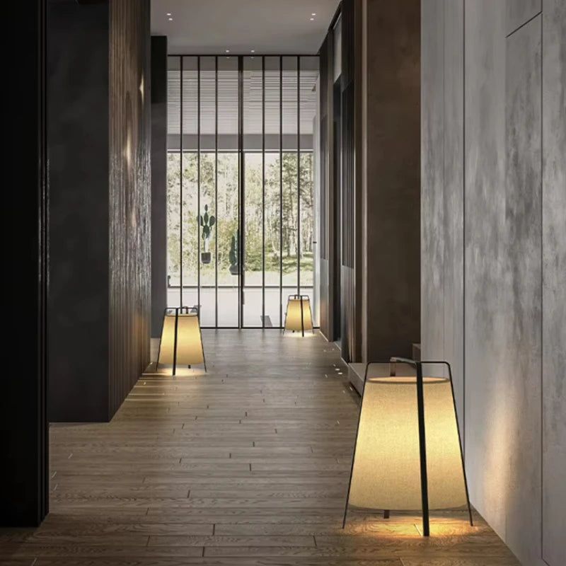 Modern hallway with floor lamps and large glass door