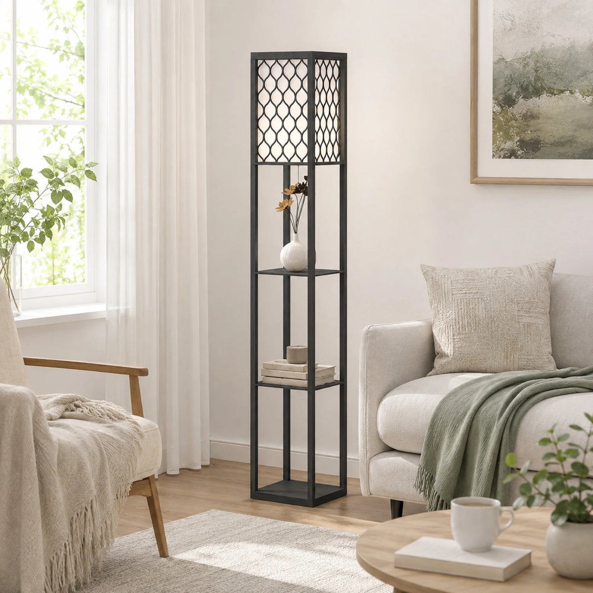 A tall black metal floor lamp with a geometric lattice top and three open shelves stands in a bright living room next to a window, sofa, and armchair.