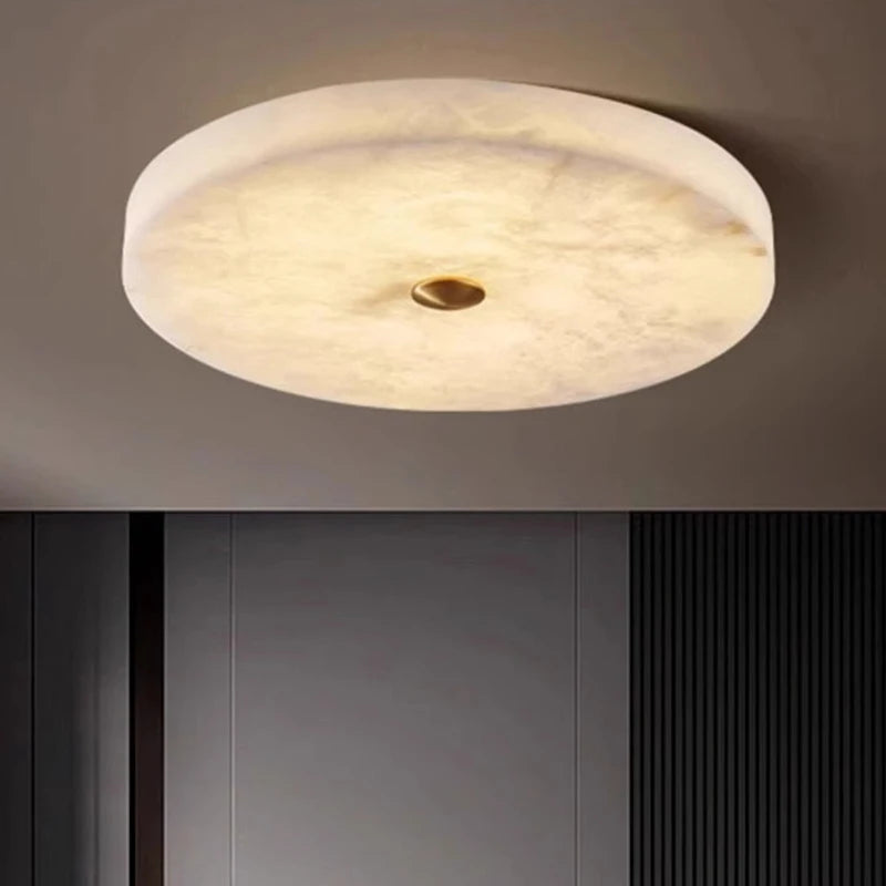 Round ceiling light fixture on a dark background