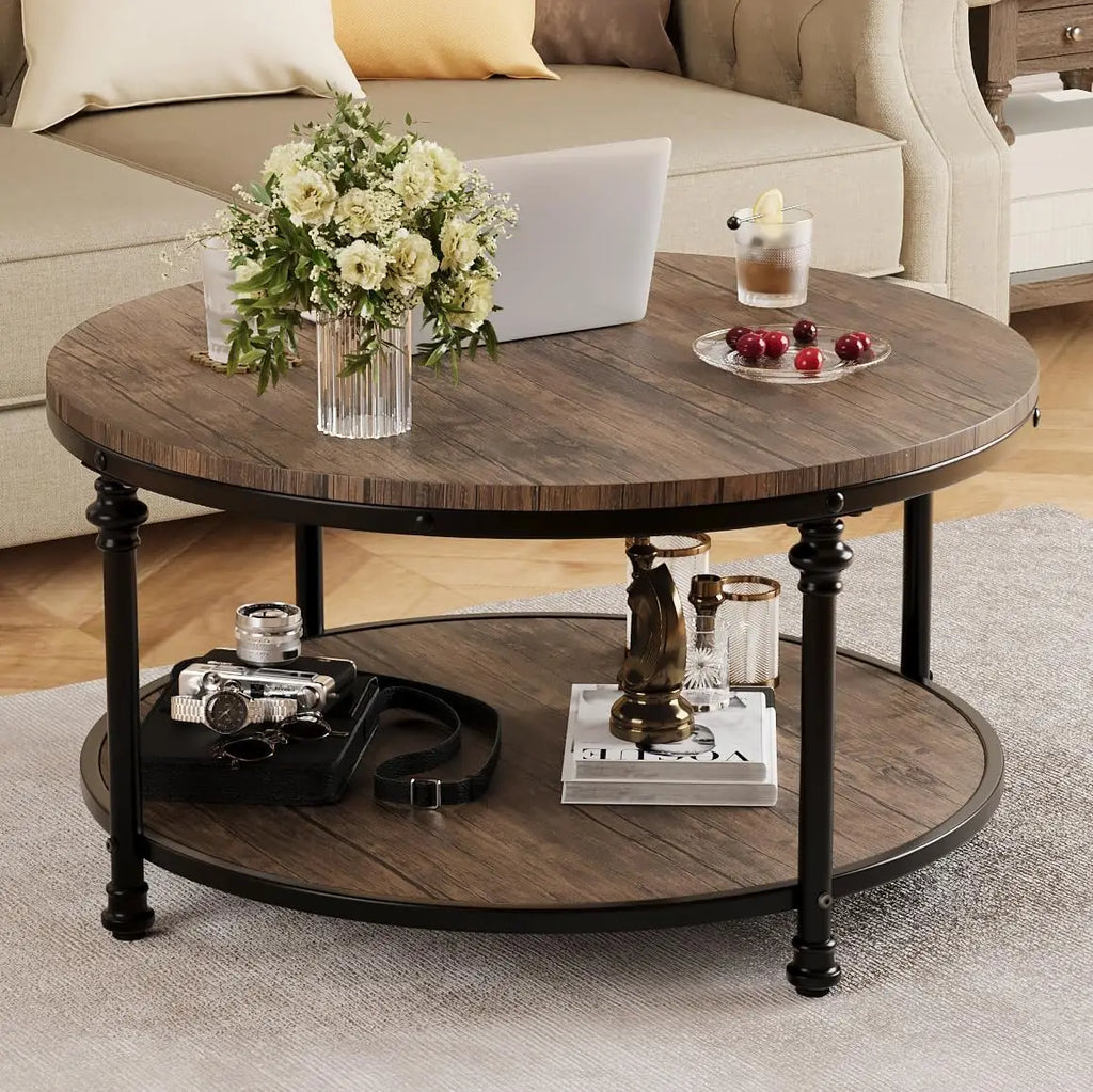 Round wooden coffee table with decorative items in a living room setting