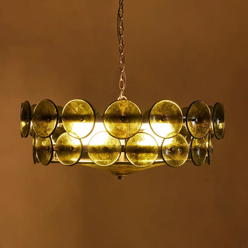 Gold chandelier with circular design on a brown background