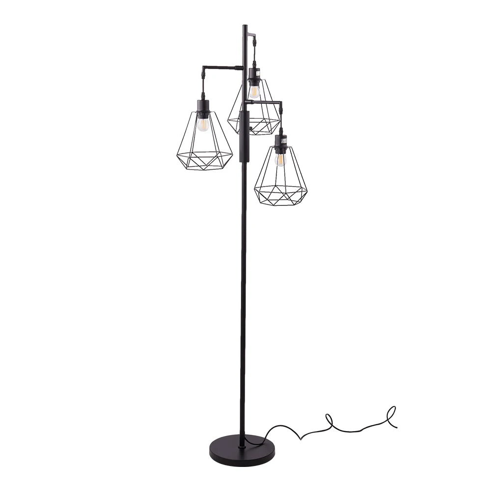 A black industrial-style floor lamp with three wire cage shades and exposed Edison bulbs, shown on a plain white background with its cord visible.