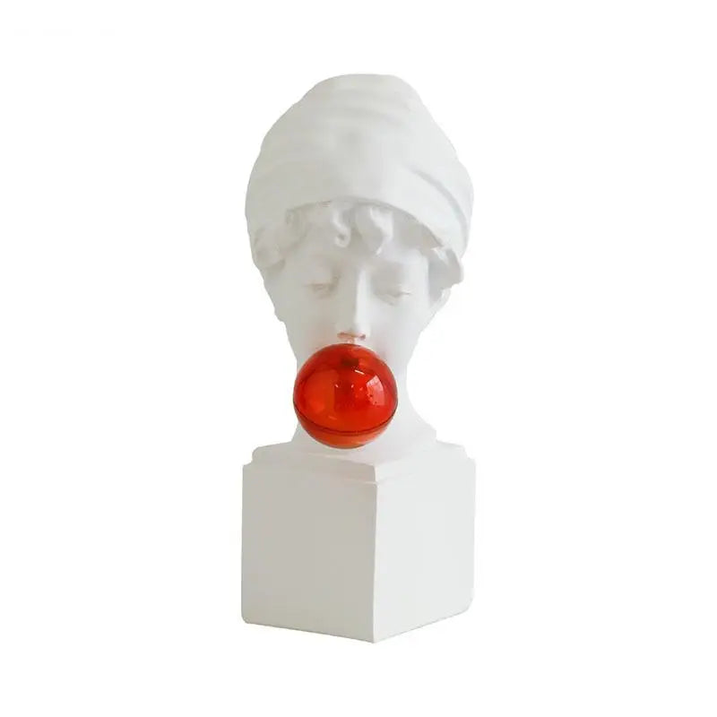 A white classical-style bust sculpture of a woman with a red translucent bubbleglass bubble, mounted on a white pedestal against a plain white background.