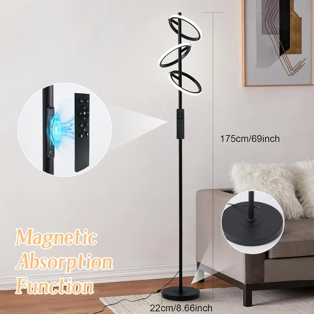 A modern black spiral floor lamp with integrated LED rings, shown in a living room setting with dimension callouts and inset detail circles explaining magnetic absorption and power control.