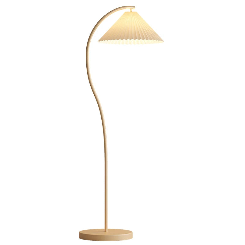 Floor lamp with a curved design and pleated shade on a white background