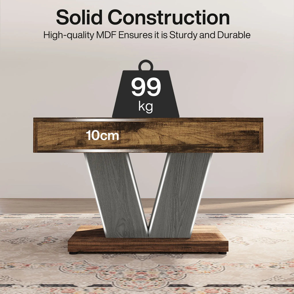 A rustic wooden coffee table with a V-shaped gray wood base with a weight of 99 kg showing the solid construction of the coffee table 
