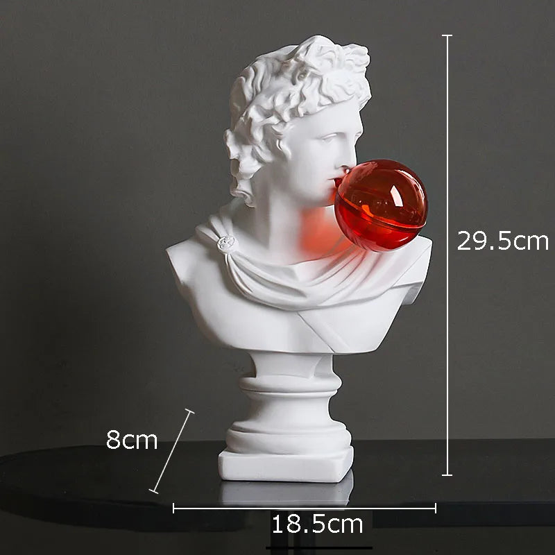 White classical bust sculpture light with a red translucent sphere protruding from the mouth, shown on a dark surface against a gray background with overlaid dimensions: 29.5 cm height, 18.